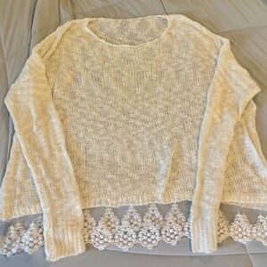 Elegant Cream Sweater with Lace Hem